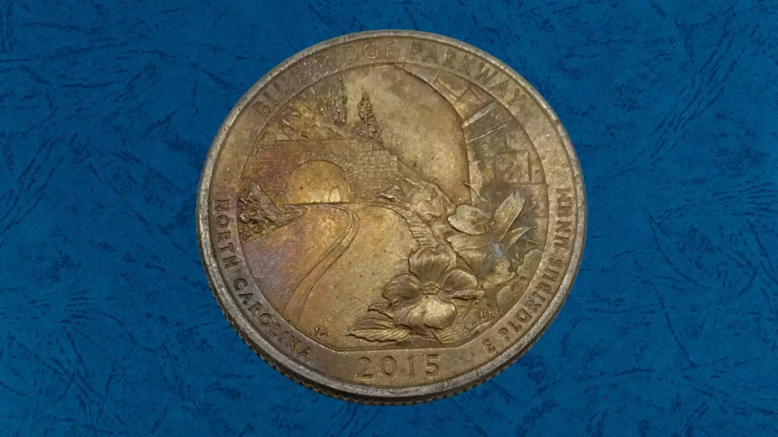2015 ATB quarter with missing clad layer error showing copper core exposed on one side